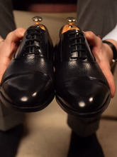 cap-toe Black Oxford shoes