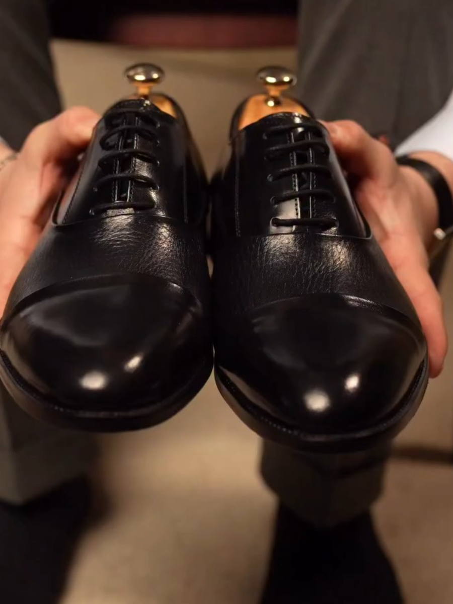 cap-toe Black Oxford shoes