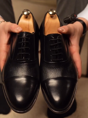 cap-toe Black Oxford shoes